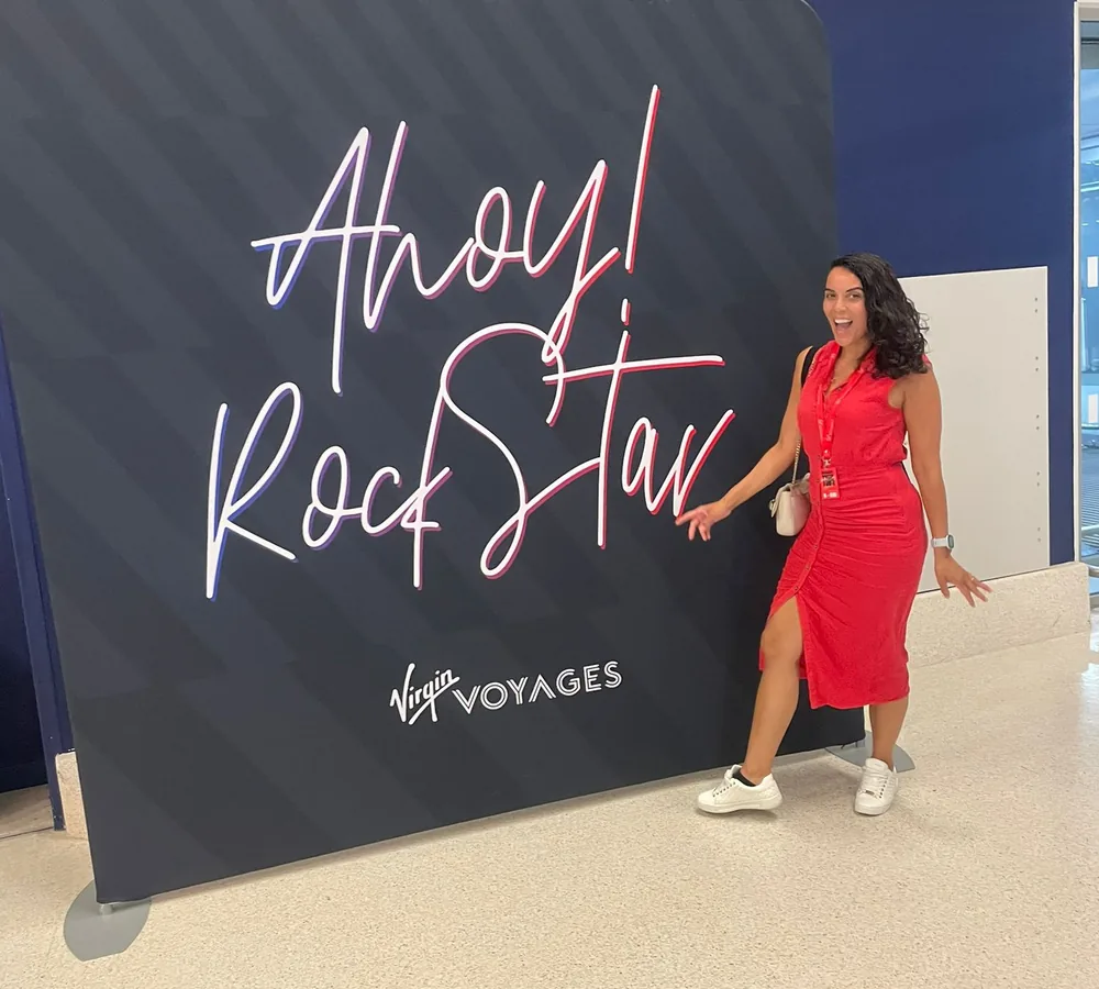 Charlene from CharsAway at the Virgin Voyages Ahoy! Rockstar display
